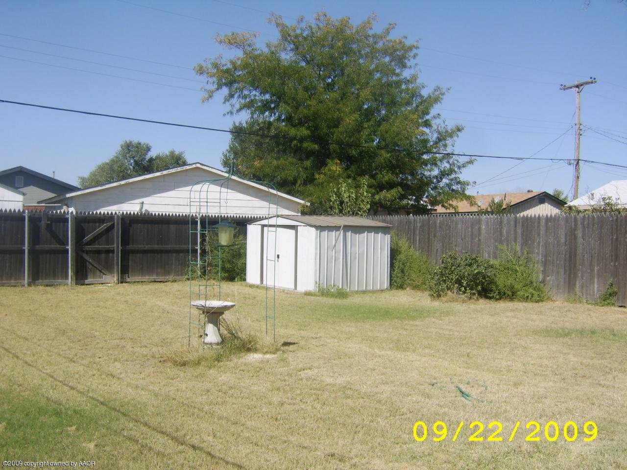 4706 South Bonham Street Amarillo, TX 79110 - Photo 4 of 9 a front view of a house with a yard