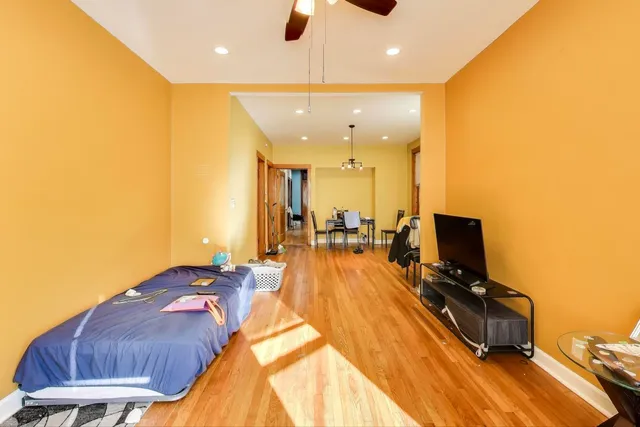 a very nice looking room with a large window and furniture