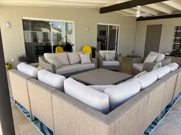 a living room with furniture a rug and a fireplace