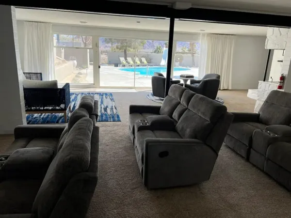 a kitchen with stainless steel appliances granite countertop a refrigerator sink and stove