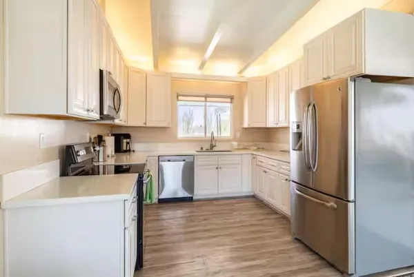 a bedroom with a bed and a chair