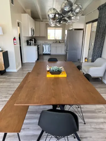 a bathroom with a double vanity sink a mirror and a shower