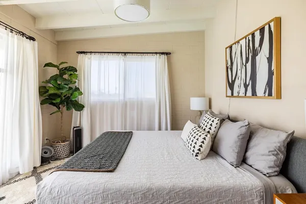 a view of a chairs and table in patio