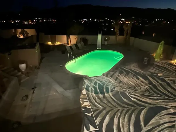 a bathroom with a shower and a sink