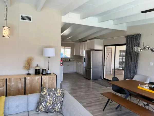 a living room with fireplace furniture and a flat screen tv