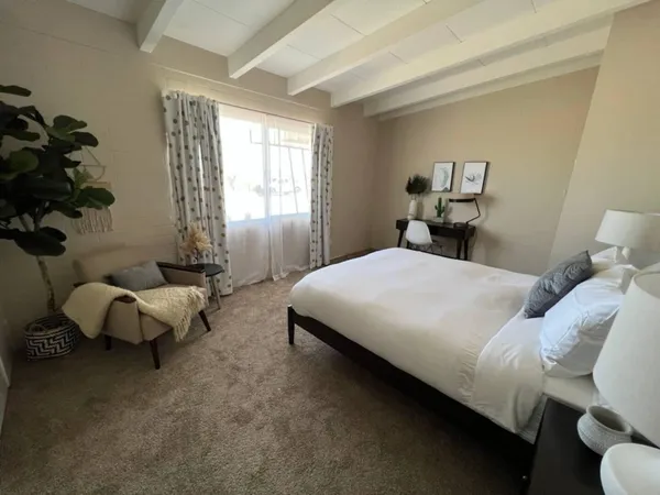 a living room with furniture a rug and a fireplace