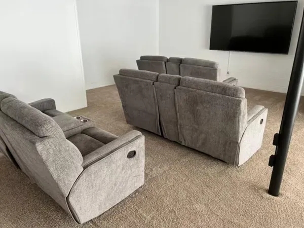 a spacious bedroom with a bed and a couch