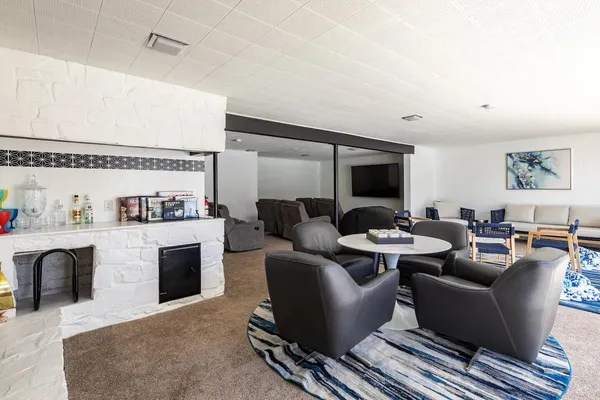 a spacious bedroom with a bed and a couch