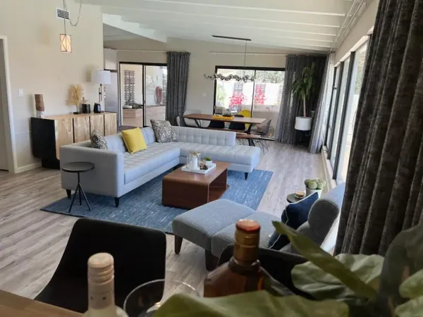 a bedroom with a bed couch and window