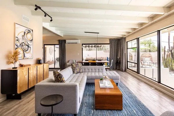 a living room with furniture and a large window