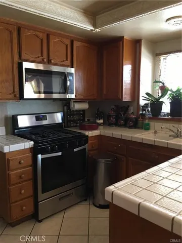 a kitchen with a stove and a microwave