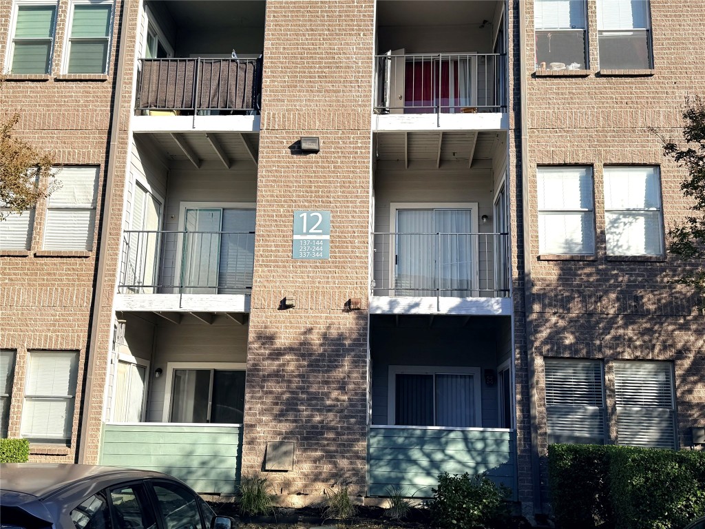 12166 Metric Boulevard, Unit 339 Austin, TX 78758 - Photo 2 of 13 a front view of a house with glass windows