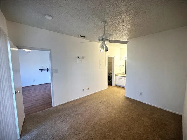 an empty room with a bathroom
