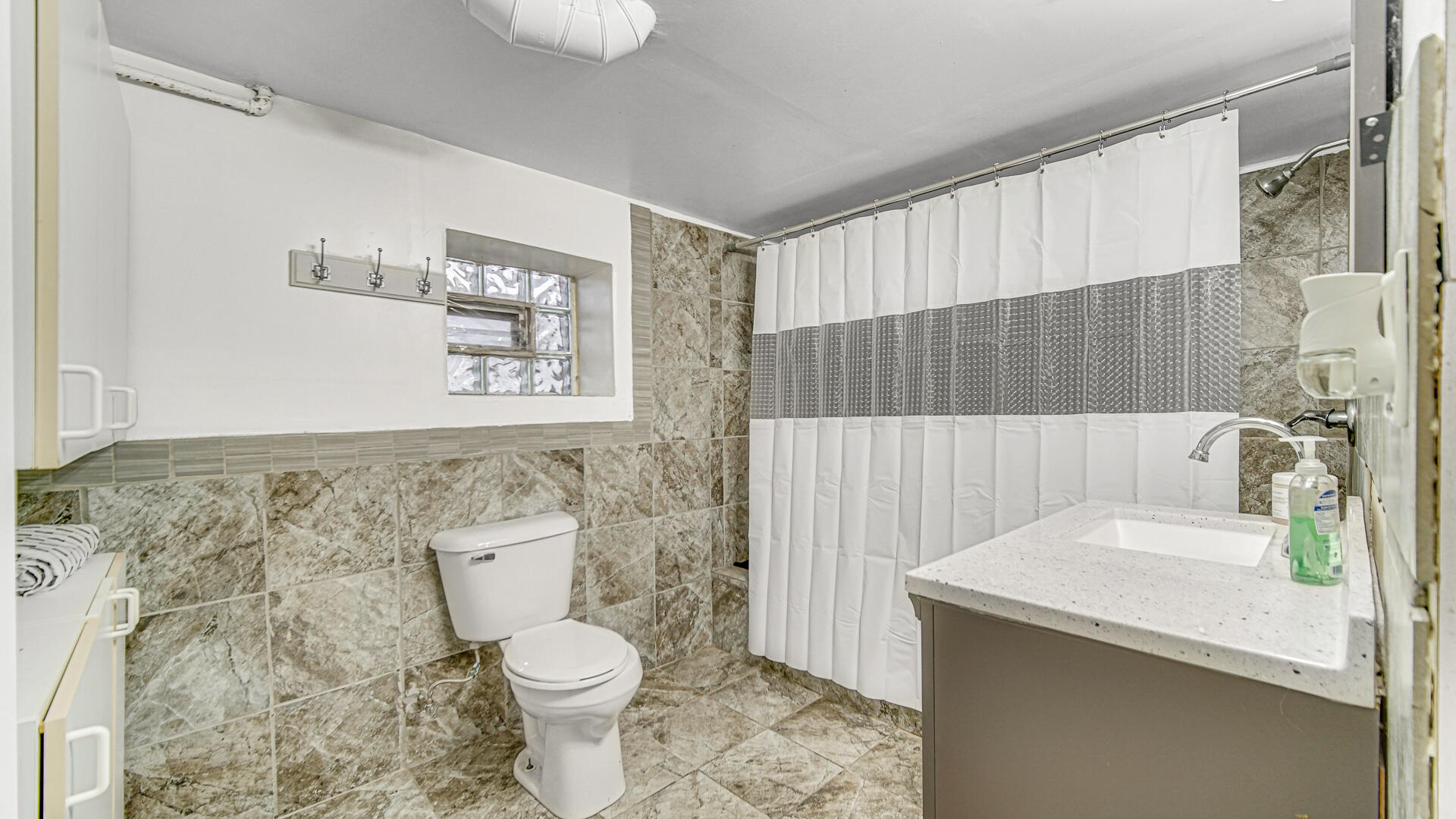 631 141st Street Hammond, IN 46327 - Photo 16 of 24 a bathroom with a sink toilet and shower