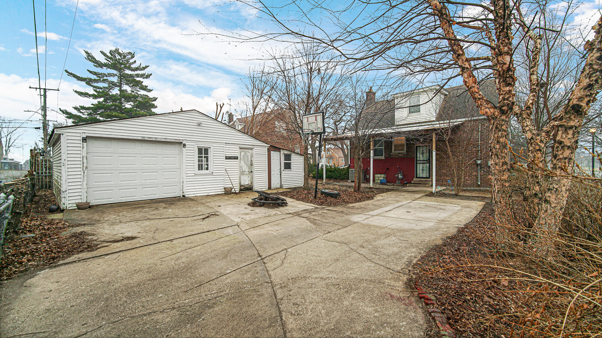 631 141st Street Hammond, IN 46327 - Photo 19 of 24 a white house with tree in front of it