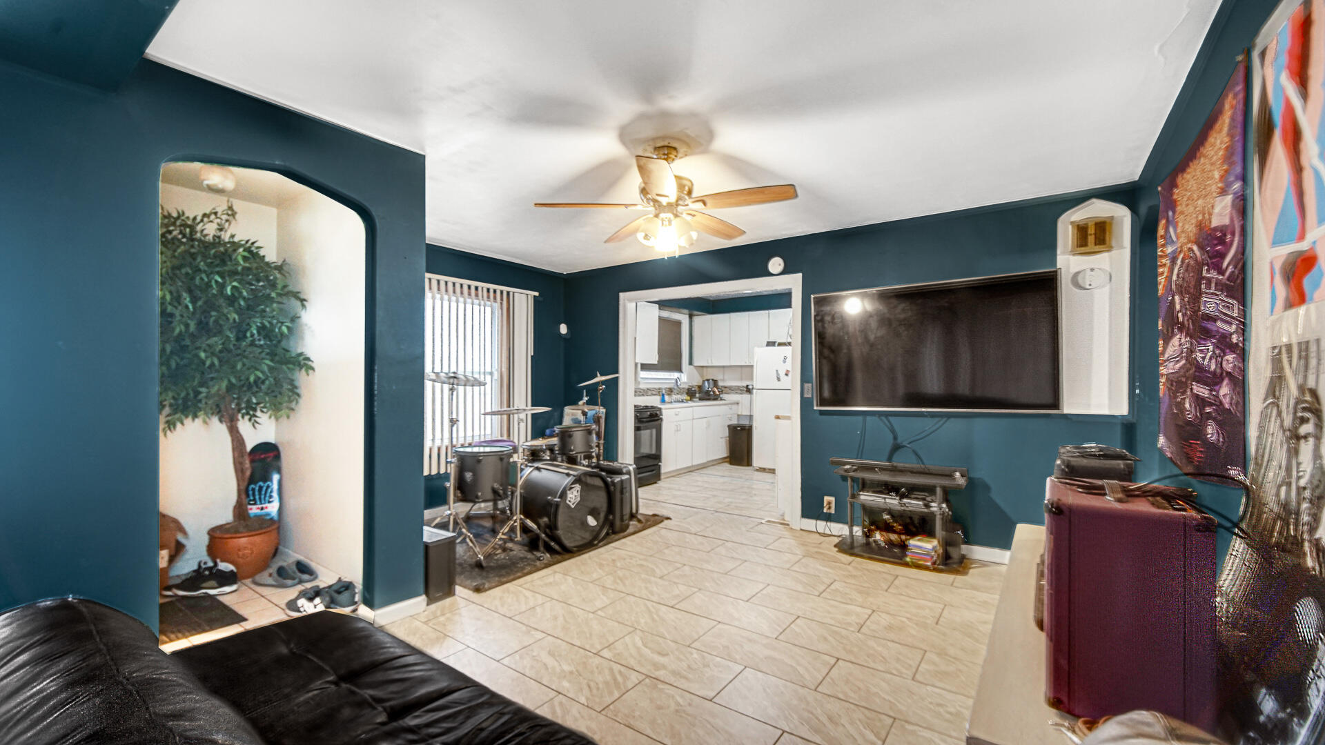 631 141st Street Hammond, IN 46327 - Photo 4 of 24 a room with furniture and a flat screen tv