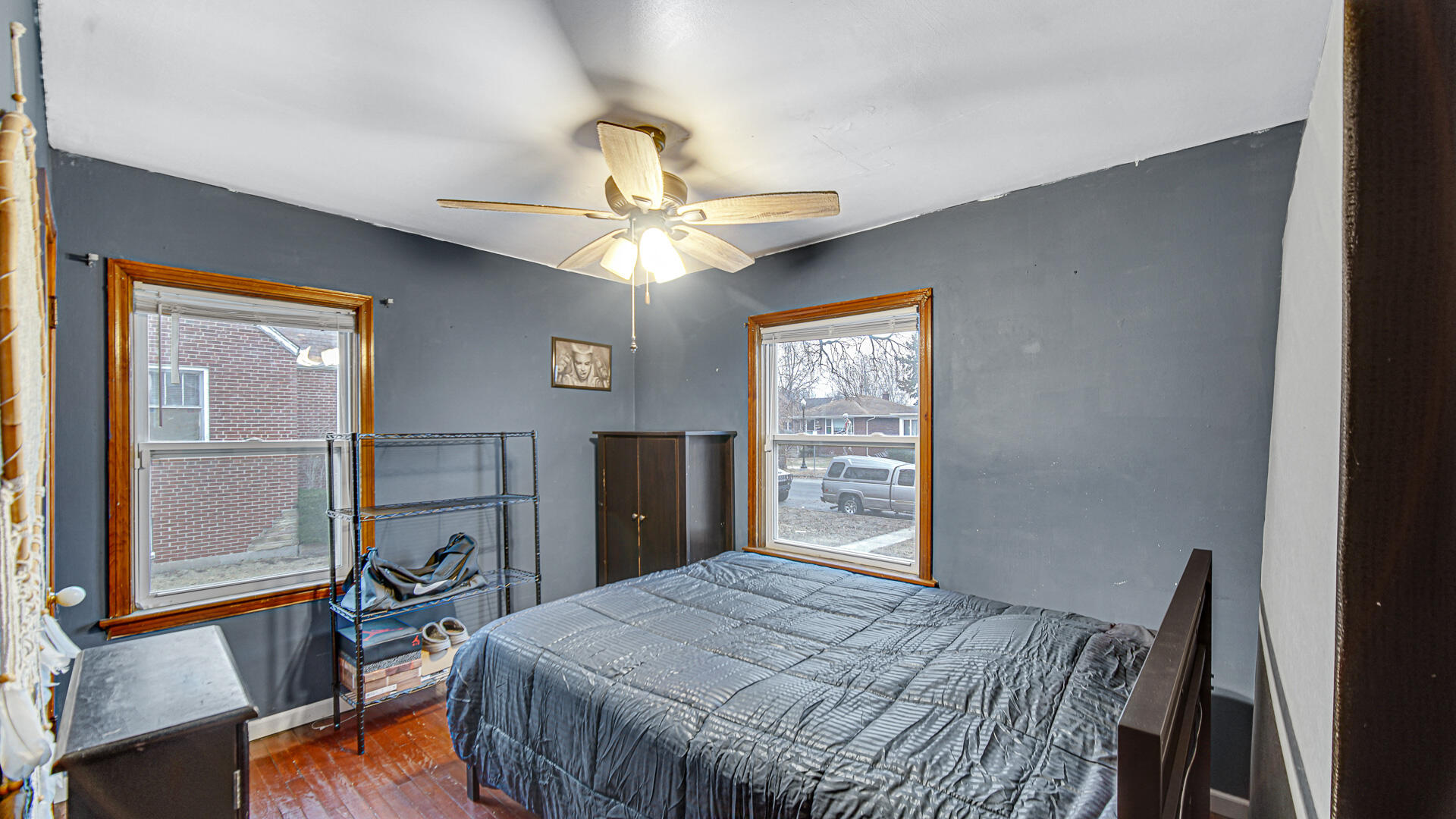 631 141st Street Hammond, IN 46327 - Photo 8 of 24 a bedroom with a bed and a chandelier