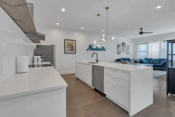 a view of kitchen with center island and stainless steel appliances