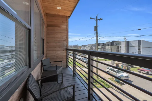 a view of a balcony with chairs