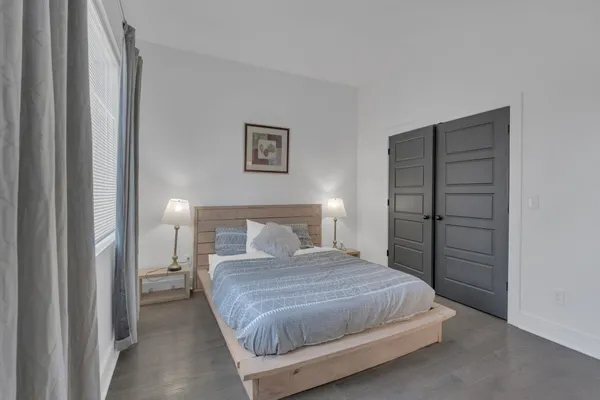 a bedroom with a bed and a closet