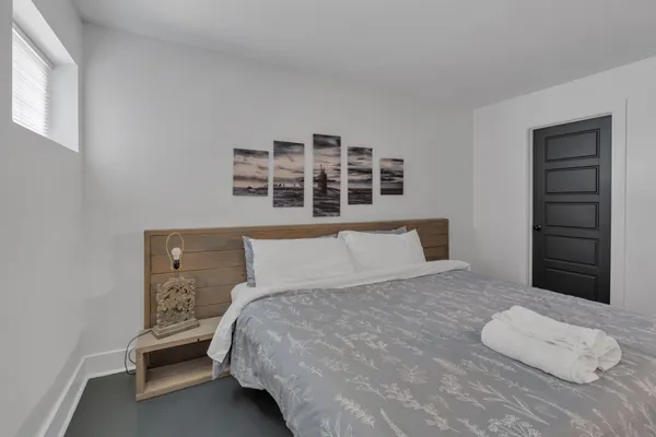 a bedroom with a bed and a cabinets