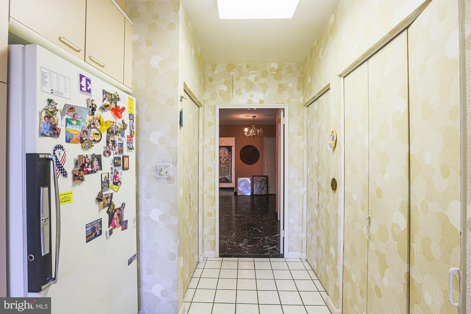 11 Slade Avenue, Unit 412 Baltimore, MD 21208 - Photo 11 of 37 Washer and dryer and pantry