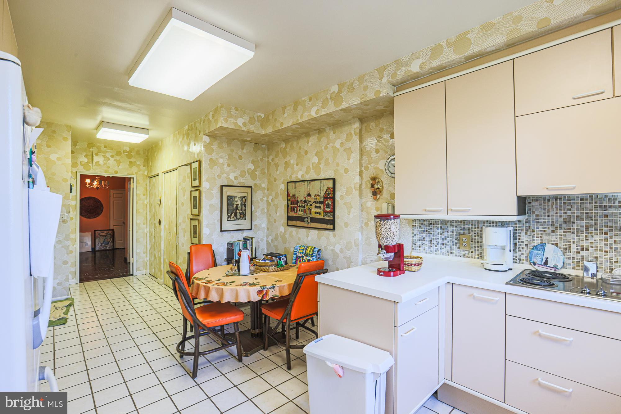 11 Slade Avenue, Unit 412 Baltimore, MD 21208 - Photo 11 of 37 a kitchen with a sink and cabinets