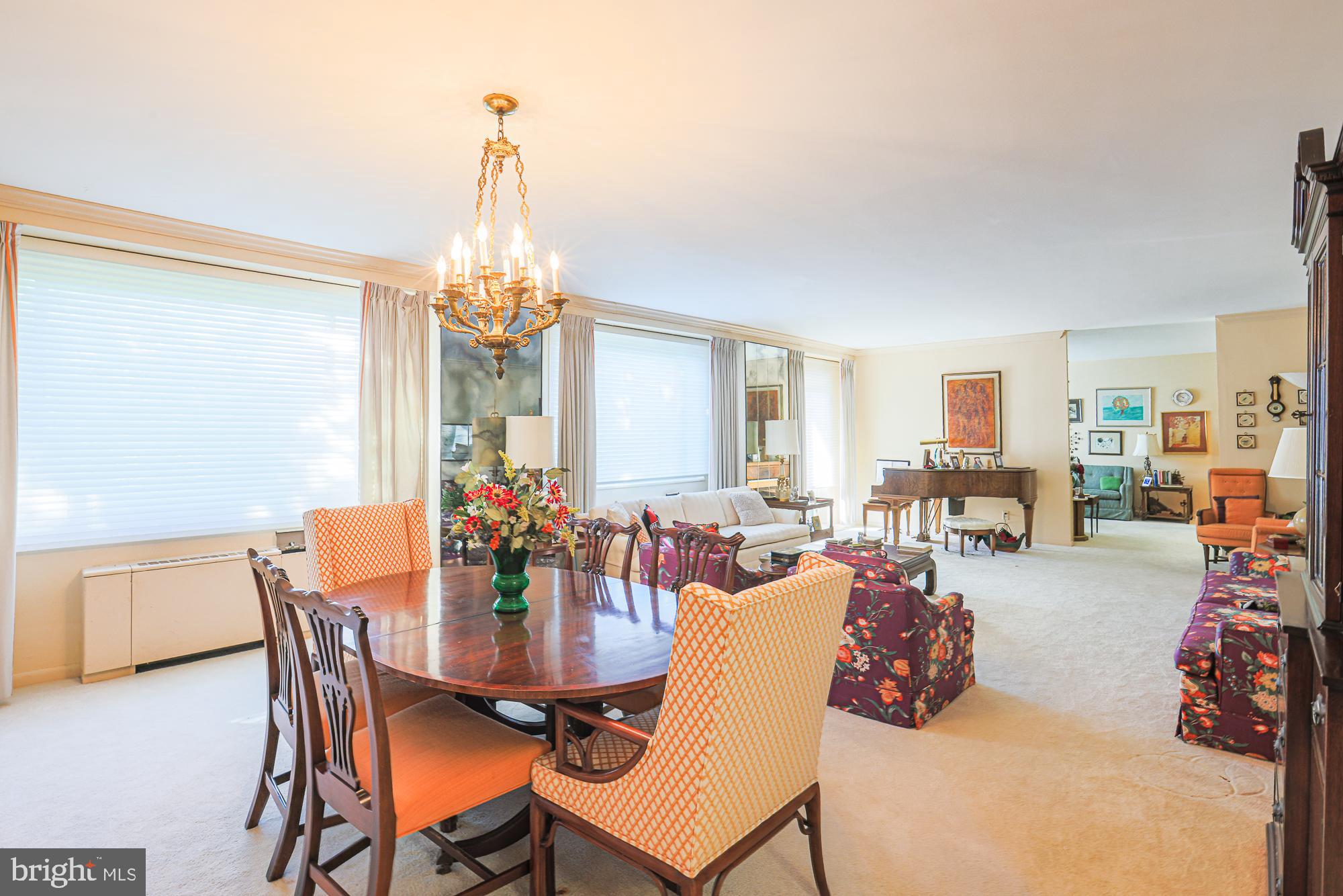 11 Slade Avenue, Unit 412 Baltimore, MD 21208 - Photo 15 of 37 a view of a dining room with furniture and chandelier