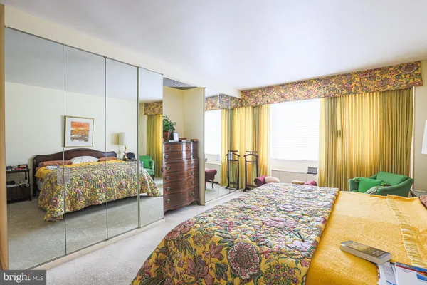 a bedroom with bed and window