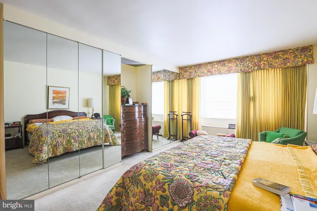 a bedroom with bed and window