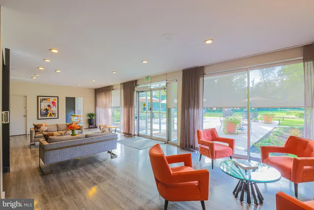a lobby with furniture and floor to ceiling window