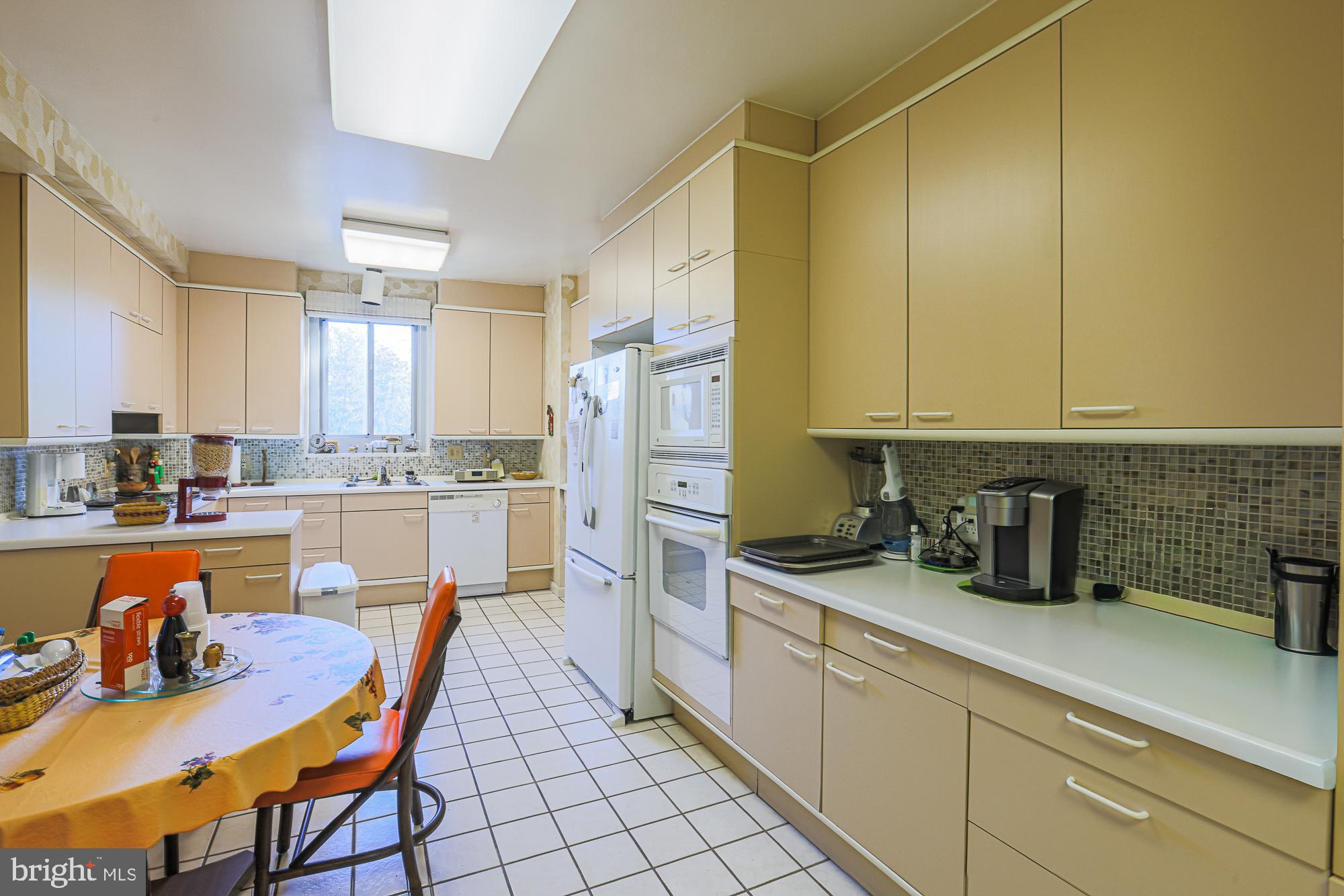 11 Slade Avenue, Unit 412 Baltimore, MD 21208 - Photo 7 of 37 a kitchen with stainless steel appliances granite countertop a sink and cabinets