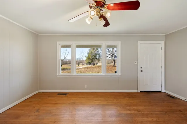 a view of an empty room with a window