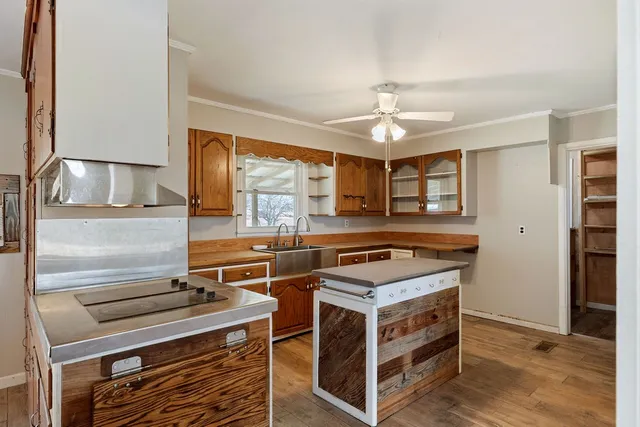 a kitchen with a stove and a chandelier