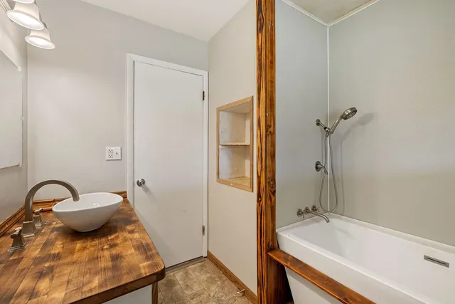 a bathroom with a sink and a mirror