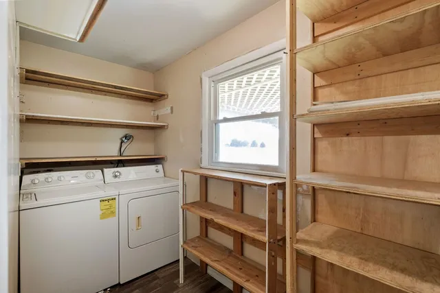 a view of storage and utility room with washer and dryer