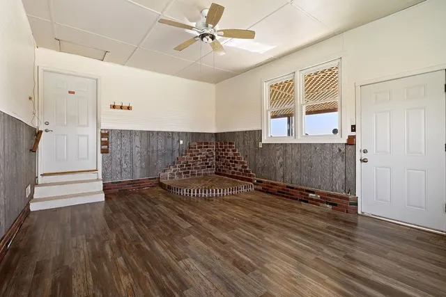 a view of a livingroom with wooden floor