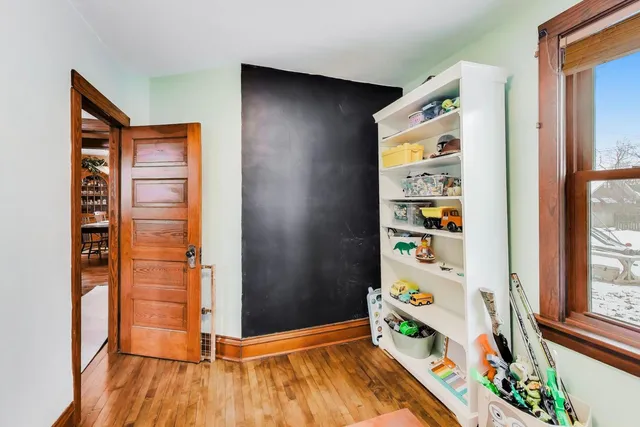 a view of front door with wooden floor