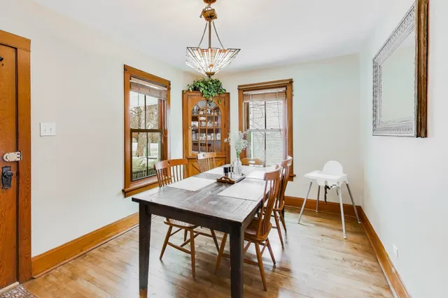 a view of a dining room with furniture and window