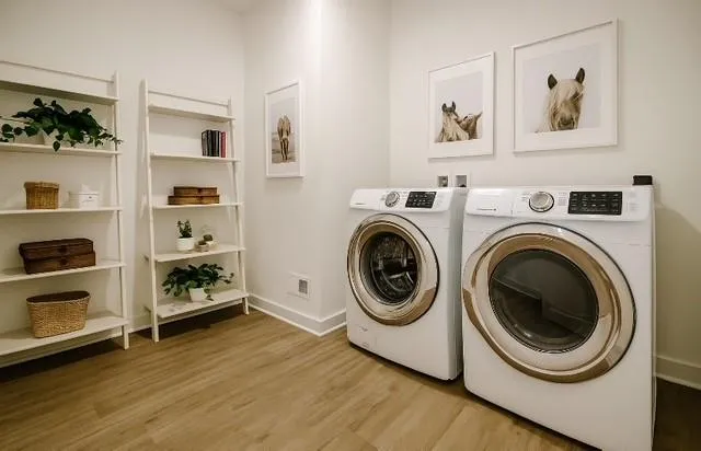 a view of a bedroom with washer and dryer