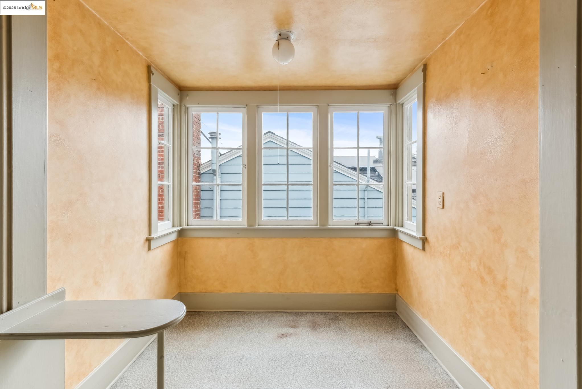 Undisclosed Address Oakland, CA 94610 - Photo 14 of 34 a view of an empty room with a window