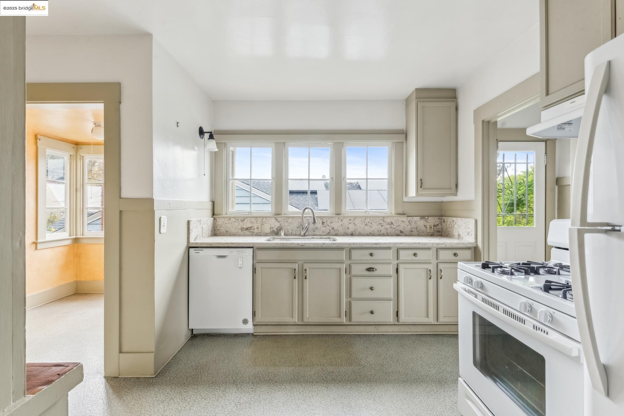 Undisclosed Address Oakland, CA 94610 - Photo 16 of 34 a spacious bathroom with a granite countertop sink and a mirror