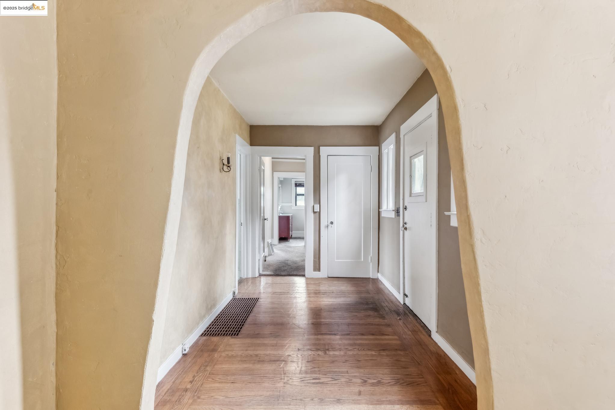 Undisclosed Address Oakland, CA 94610 - Photo 21 of 34 a view of a hallway with wooden floor