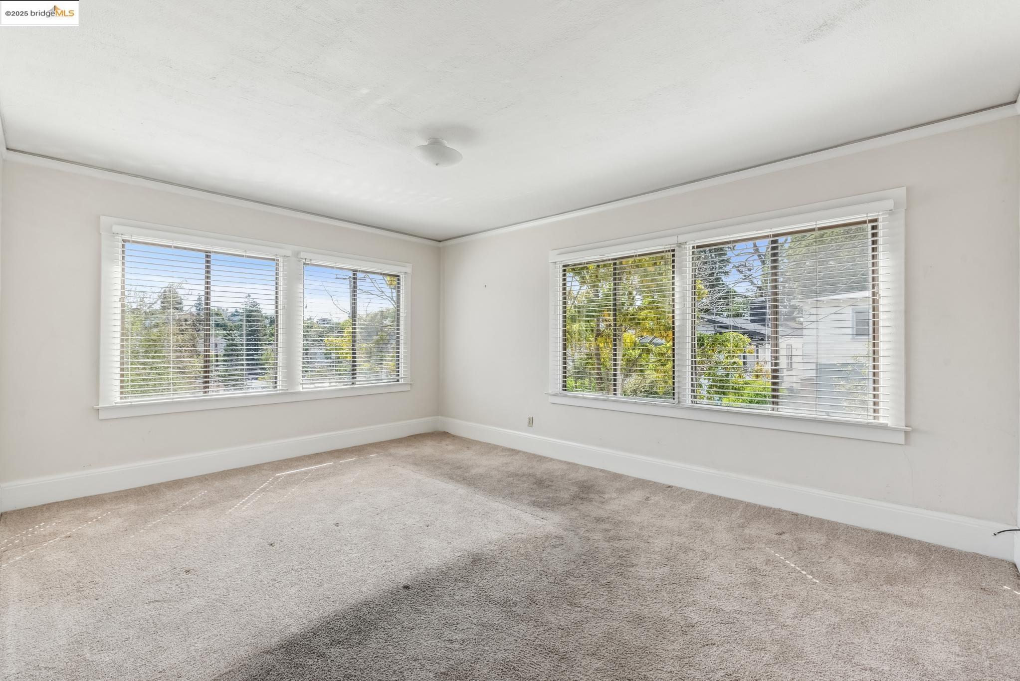Undisclosed Address Oakland, CA 94610 - Photo 22 of 34 an empty room with windows