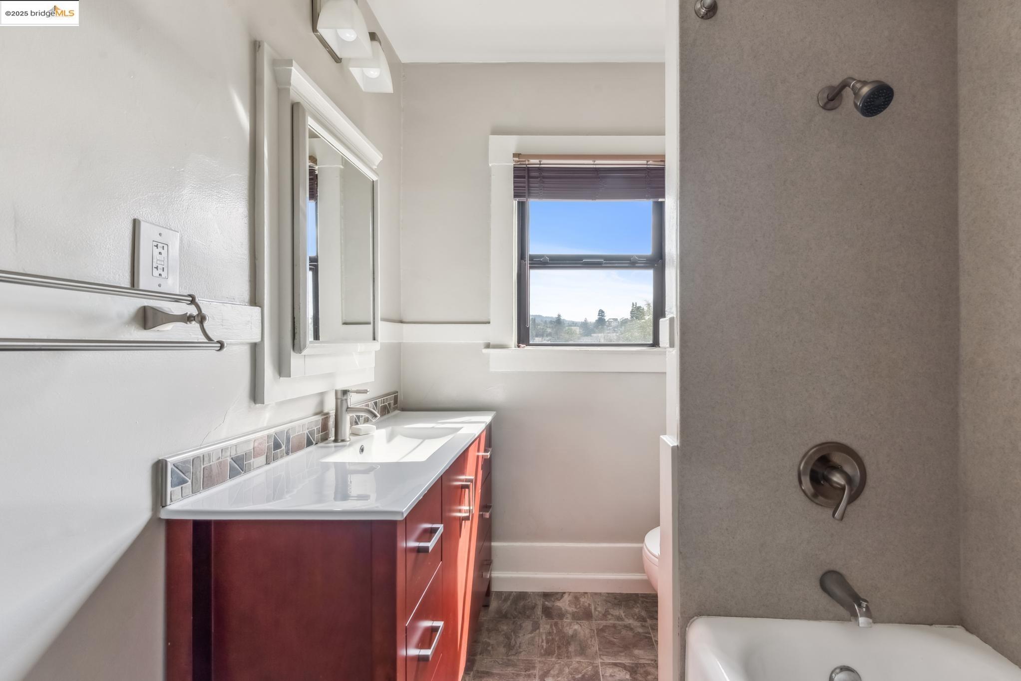 Undisclosed Address Oakland, CA 94610 - Photo 25 of 34 a bathroom with a sink toilet and shower