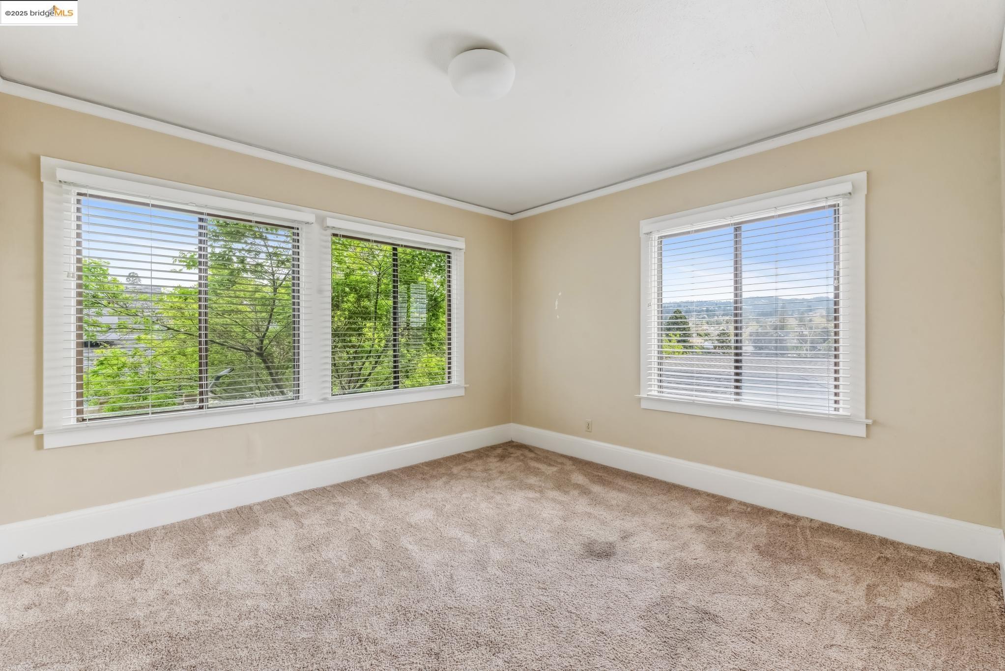 Undisclosed Address Oakland, CA 94610 - Photo 26 of 34 a view of an empty room with a window