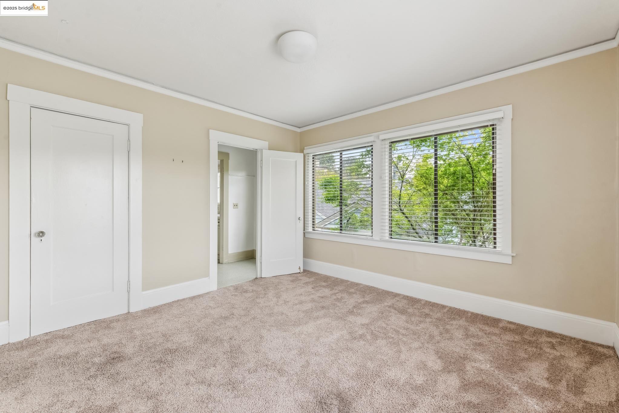 Undisclosed Address Oakland, CA 94610 - Photo 28 of 34 a view of an empty room with a window