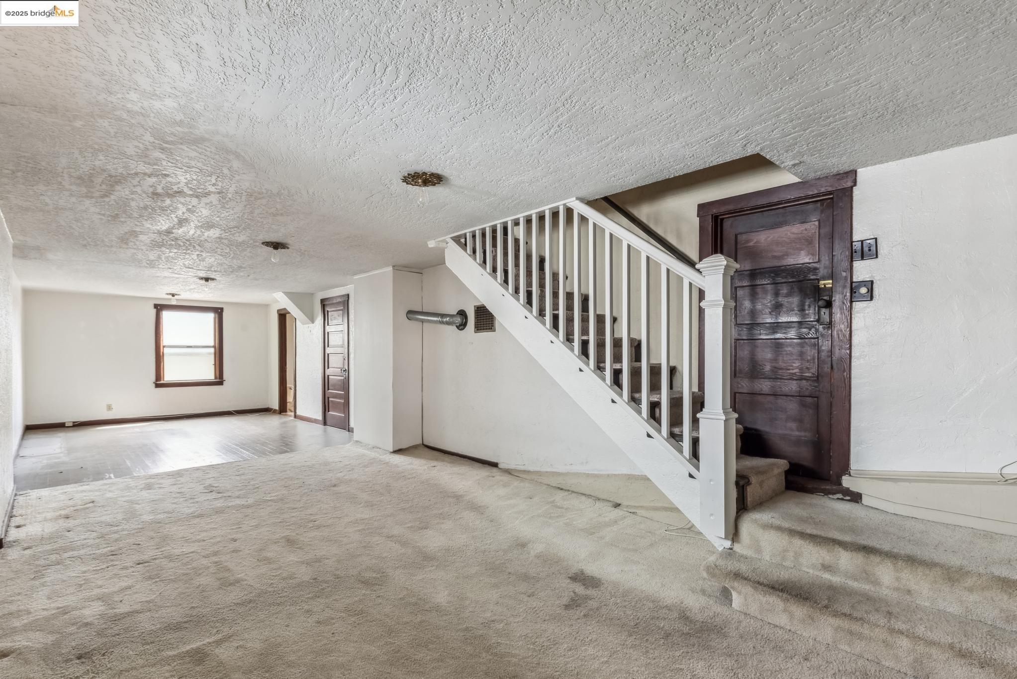 Undisclosed Address Oakland, CA 94610 - Photo 29 of 34 a view of a hallway with staircase