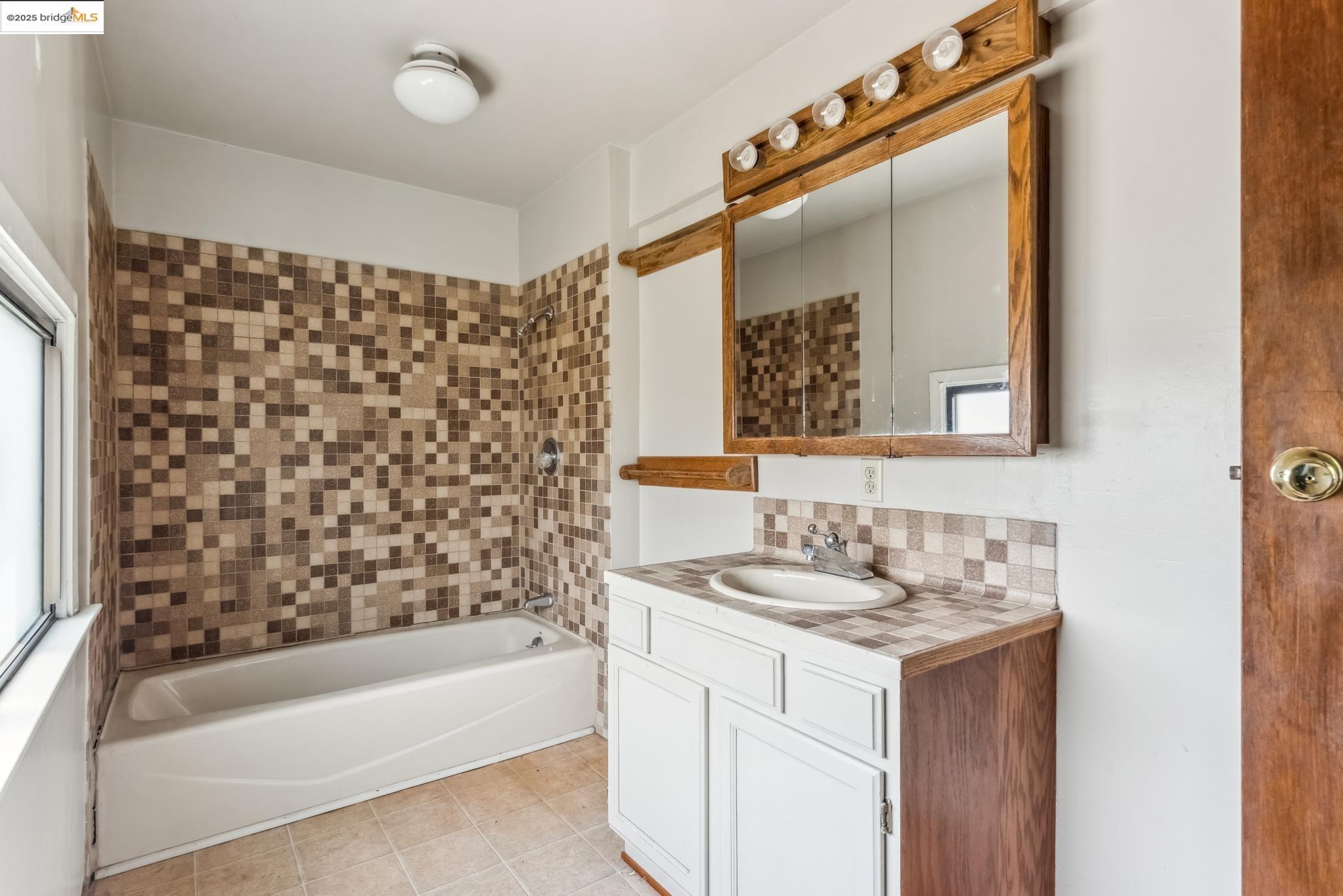 Undisclosed Address Oakland, CA 94610 - Photo 32 of 34 a bathroom with a sink and a mirror