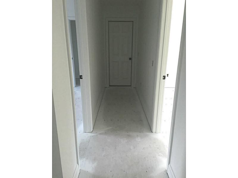 14 Shady Grove Road Hopkinton, RI 02832 - Photo 16 of 23 Other. Hallway to Bonus room behind the closed door and open doors are entrances to bedroom 2 and bedroom 3